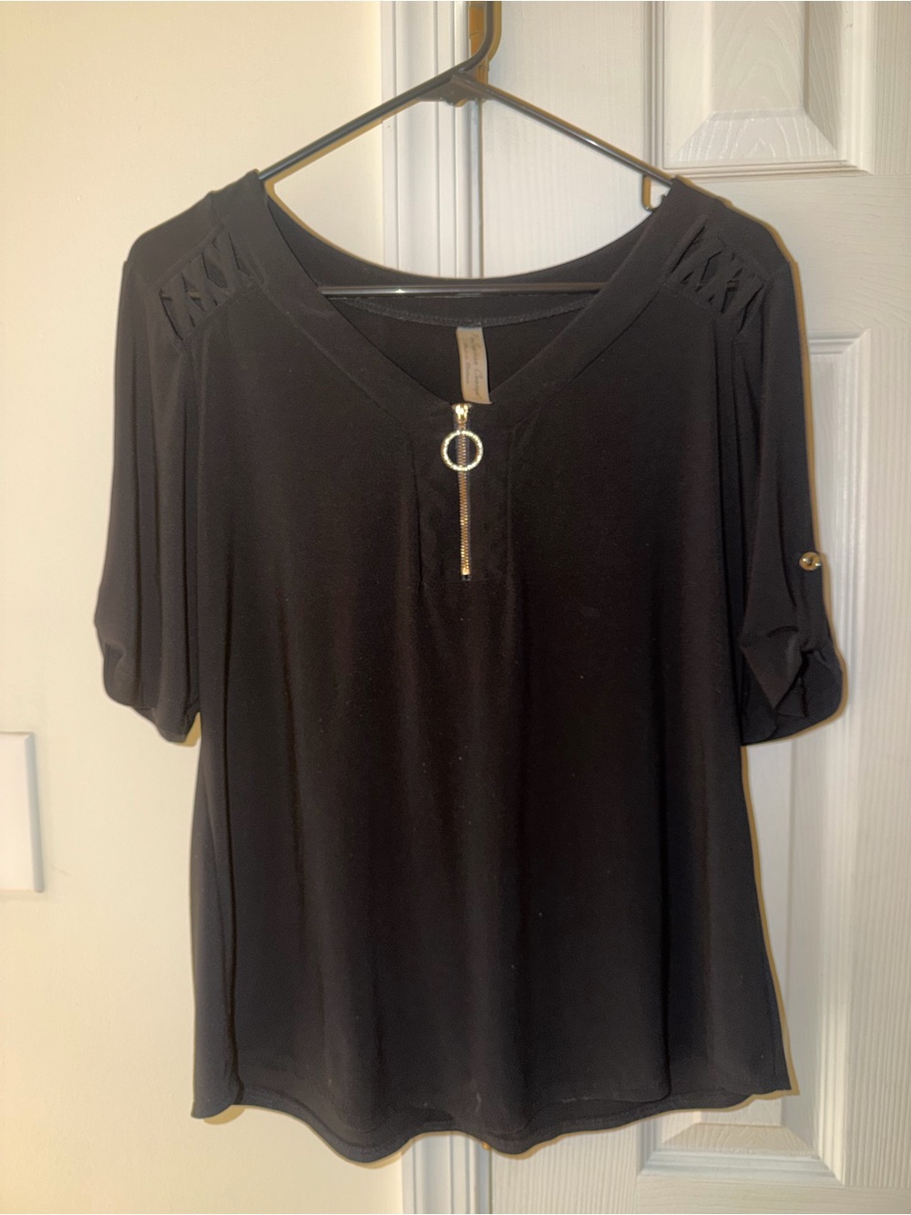black casual shirt with gold button sleeve diamond like ring to zip